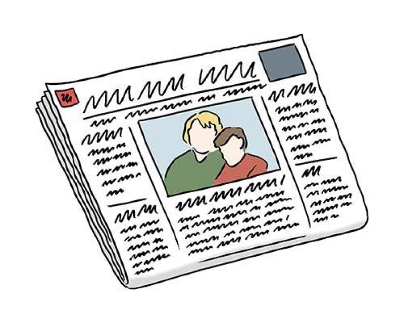Eine Zeitung mit einem Foto von zwei Personen.
